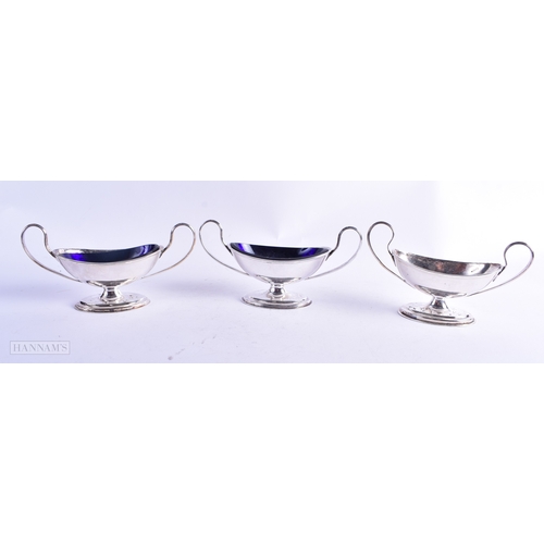 31 - A SET OF SEVEN GEORGE III SILVER PLATED NEO CLASSICAL SALTS. 14.75 cm x 6.25 cm. (7)