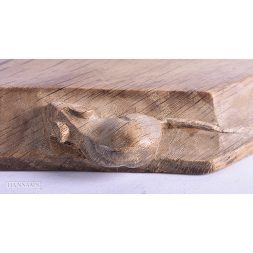 40 - A ROBERT MOUSEMAN CARVED WOOD CHEESE BOARD. 30 cm x 22 cm.