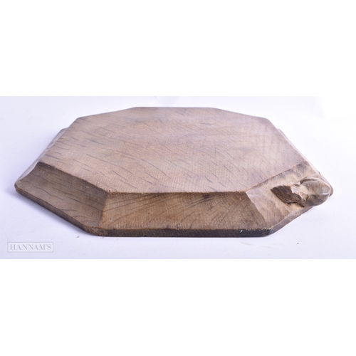 40 - A ROBERT MOUSEMAN CARVED WOOD CHEESE BOARD. 30 cm x 22 cm.