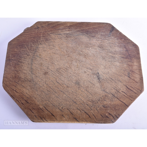 40 - A ROBERT MOUSEMAN CARVED WOOD CHEESE BOARD. 30 cm x 22 cm.