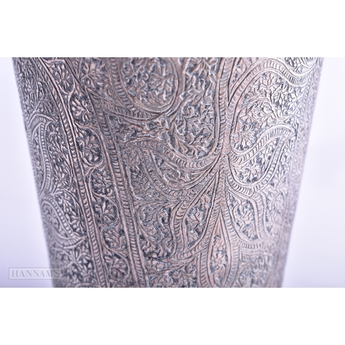 42 - A 19TH CENTURY ISLAMIC PERSIAN WHITE METAL BEAKER decorated with foliage. 245.3 grams. 13.75 cm high... 