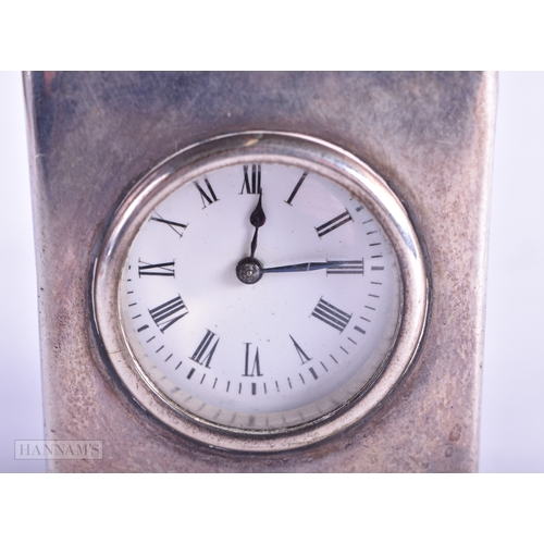 52 - AN EDWARDIAN SILVER CASED TRAVELLING CLOCK. London 1901. 268.6 grams overall. 9.25 cm x 4.75 cm.