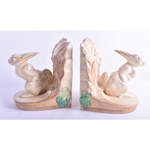 56 - AN UNUSUAL PAIR OF BESWICK WARE CERAMIC BOOKENDS. 14 cm x 12 cm.