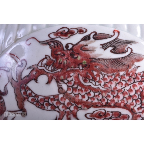 64 - A CHINESE QING DYNASTY IRON RED PAINTED GINGER JAR AND COVER painted with phoenix birds and dragons.... 