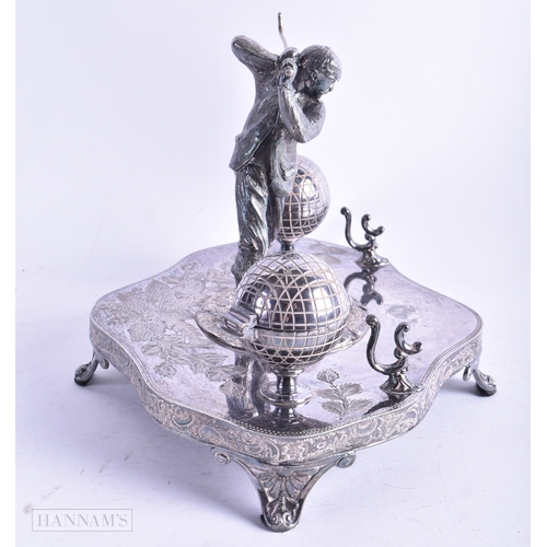 74 - AN UNUSUAL LATE VICTORIAN/EDWARDIAN SILVER PLATED GOLFING INKWELL formed as a male swinging a club, ... 