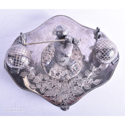 74 - AN UNUSUAL LATE VICTORIAN/EDWARDIAN SILVER PLATED GOLFING INKWELL formed as a male swinging a club, ... 