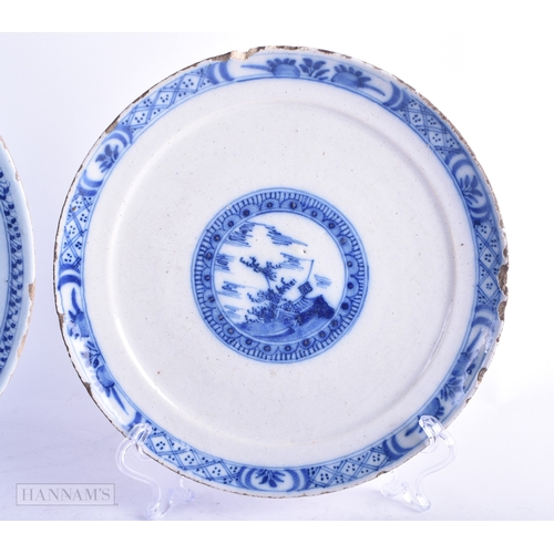 75 - AN 18TH CENTURY ENGLISH CREAMWARE TEABOWL AND SAUCER together with two Delft plates. Largest 21 cm d... 