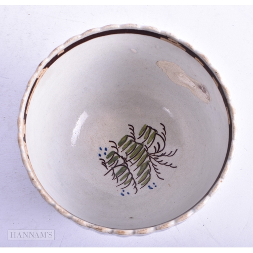 75 - AN 18TH CENTURY ENGLISH CREAMWARE TEABOWL AND SAUCER together with two Delft plates. Largest 21 cm d... 