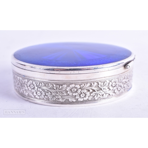 88 - AN ART DECO SILVER AND ENAMEL BOX AND COVER. 123.7 grams. 7 cm diameter.