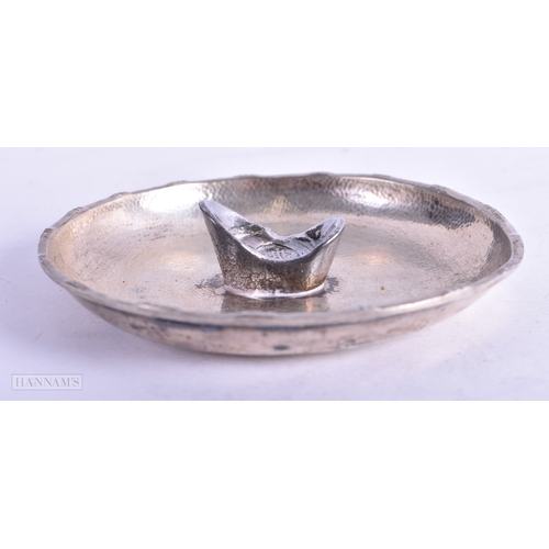 89 - AN ANTIQUE CHINESE SILVER INGOT DISH. 70 grams. 9 cm wide.