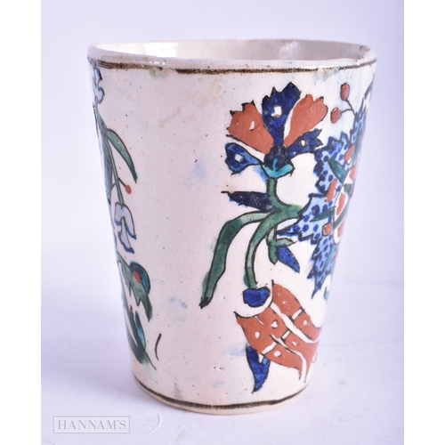 94 - A MIDDLE EASTERN ISLAMIC IZNIK TYPE BEAKER. 10 cm high.