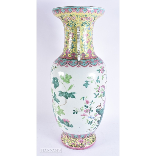 609 - A VERY LARGE 19TH CENTURY CHINESE TWIN HANDLED PORCELAIN VASE Qing, painted with bold enamelled flow... 