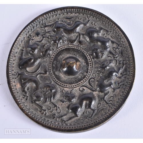 610 - TWO EARLY CHINESE SILVERED BRONZE HAND MIRRORS one decorated with animals, the other with motifs. La... 