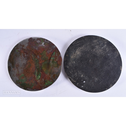 610 - TWO EARLY CHINESE SILVERED BRONZE HAND MIRRORS one decorated with animals, the other with motifs. La... 