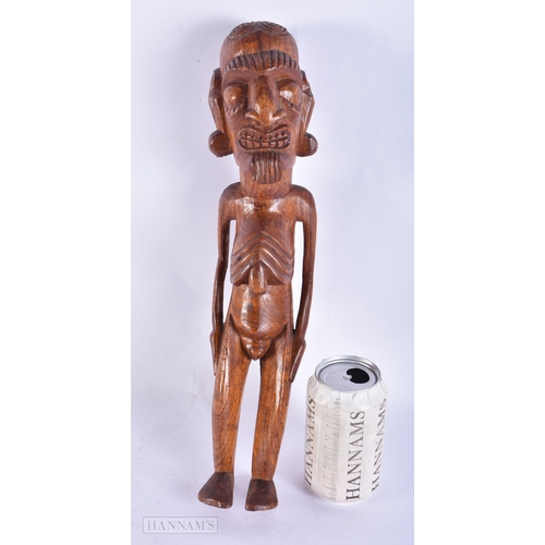 101 - AN EASTER ISLANDS CARVED WOOD FIGURE OF A MALE. 38 cm high.