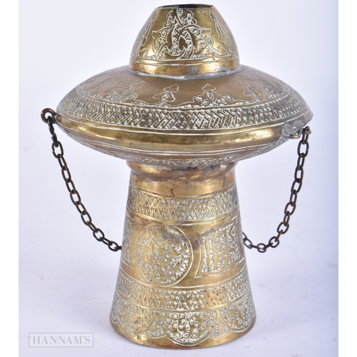 107 - A 19TH CENTURY ISLAMIC MIDDLE EASTERN BRASS HANGING CENSER decorated with scripture. 12cm high.