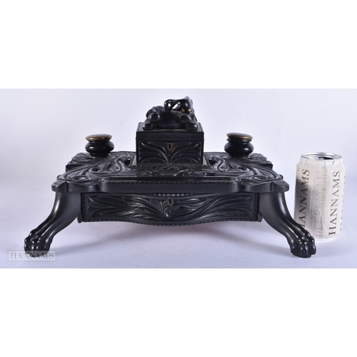 110 - A FINE LARGE MID 19TH CENTURY CEYLON SRI LANKAN INDIAN CARVED EBONY DESK STAND formed with an elepha... 