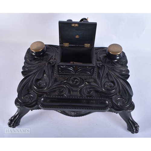 110 - A FINE LARGE MID 19TH CENTURY CEYLON SRI LANKAN INDIAN CARVED EBONY DESK STAND formed with an elepha... 