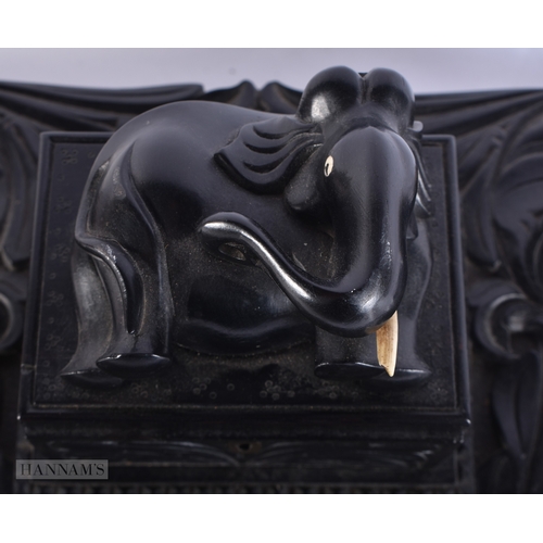 110 - A FINE LARGE MID 19TH CENTURY CEYLON SRI LANKAN INDIAN CARVED EBONY DESK STAND formed with an elepha... 