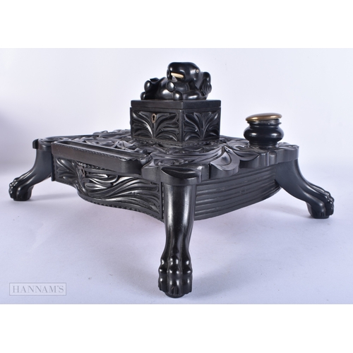 110 - A FINE LARGE MID 19TH CENTURY CEYLON SRI LANKAN INDIAN CARVED EBONY DESK STAND formed with an elepha... 