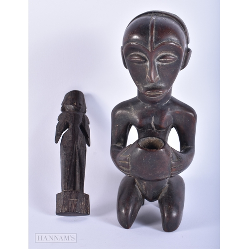 147 - AN AFRICAN TRIBAL CARVED WOOD FIGURE together with another Indian wood deity. Largest 23.5 cm high. ... 