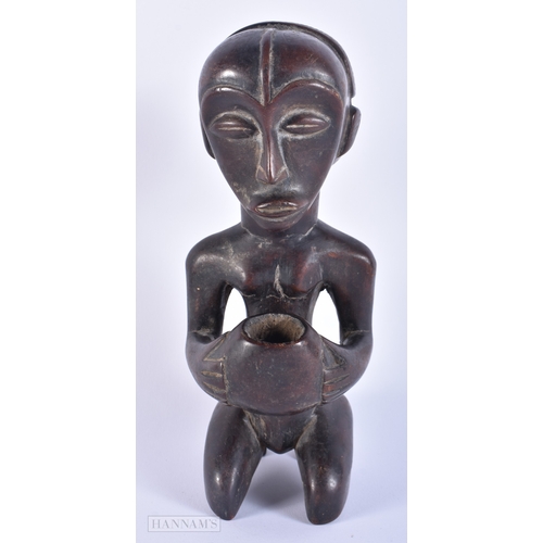 147 - AN AFRICAN TRIBAL CARVED WOOD FIGURE together with another Indian wood deity. Largest 23.5 cm high. ... 