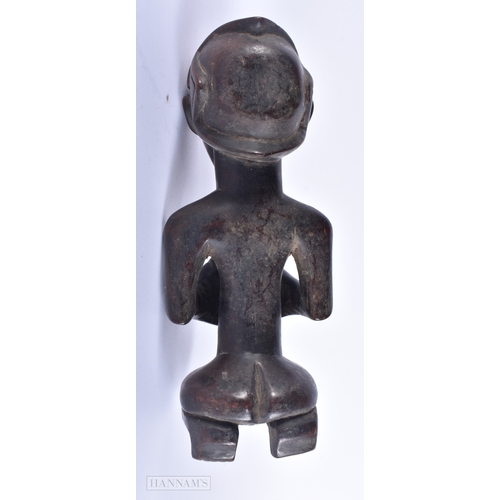 147 - AN AFRICAN TRIBAL CARVED WOOD FIGURE together with another Indian wood deity. Largest 23.5 cm high. ... 