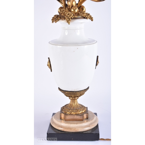 149 - AN UNUSUAL LARGE ANTIQUE FRENCH PORCELAIN AND ORMOLU COUNTRY HOUSE LAMP. 82 cm high.