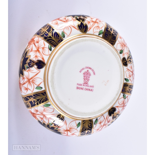 150 - A ROYAL CROWN DERBY IMARI PORCELAIN LIGHTER together with a similar cup and saucer. (3)