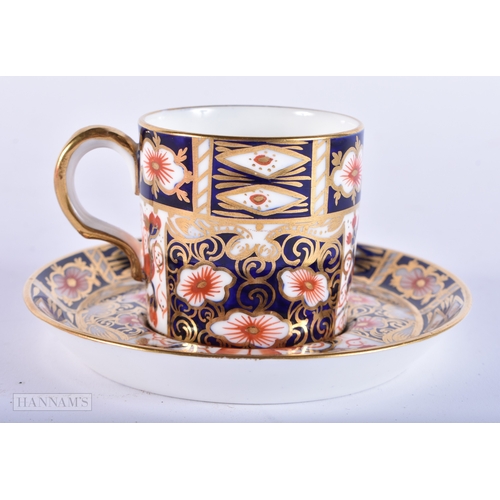 150 - A ROYAL CROWN DERBY IMARI PORCELAIN LIGHTER together with a similar cup and saucer. (3)