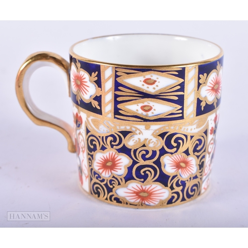 150 - A ROYAL CROWN DERBY IMARI PORCELAIN LIGHTER together with a similar cup and saucer. (3)