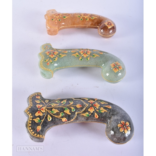 167 - THREE ISLAMIC MIDDLE EASTERN QAJAR ENAMELLED HARDSTONE DAGGER HANDLES. 15 cm long. (3)