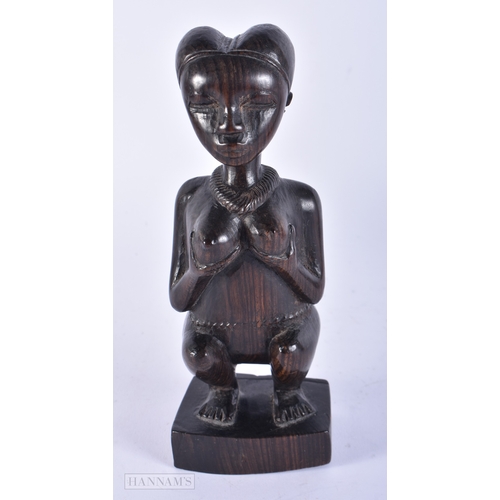 180 - TWO AFRICAN CARVED HARDWOOD TRIBAL FIGURES. Largest 22 cm high. (2)