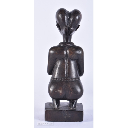 180 - TWO AFRICAN CARVED HARDWOOD TRIBAL FIGURES. Largest 22 cm high. (2)