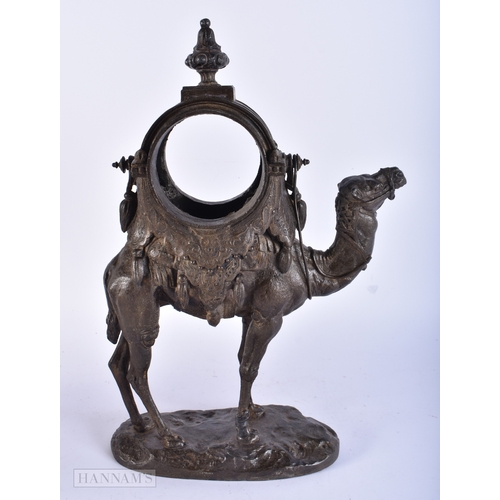 192 - A 19TH CENTURY FRENCH SPELTER CAMEL CLOCK CASE together with a brass flagon. Largest 34 cm high. (2)