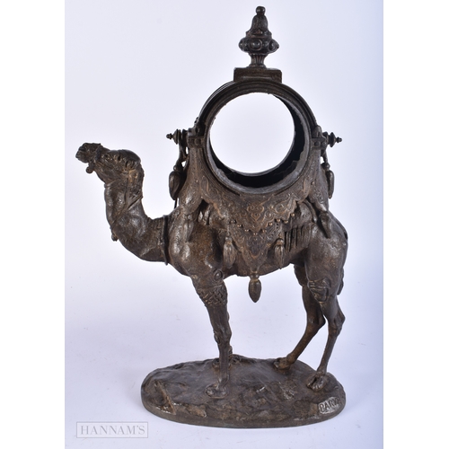 192 - A 19TH CENTURY FRENCH SPELTER CAMEL CLOCK CASE together with a brass flagon. Largest 34 cm high. (2)