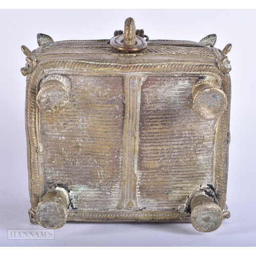 194 - AN ANTIQUE INDIAN BRONZE CASKET together with a musical box cathedral. Largest 12cm wide. (2)