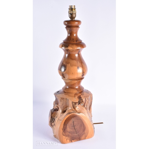 312 - A LARGE EARLY 20TH CENTURY YEW WOOD RUSTIC LAMP of naturalistic form. 52 cm x 22 cm.