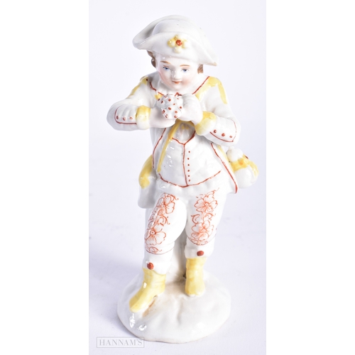 329 - AN ANTIQUE CONTINENTAL PORCELAIN FIGURE OF A BOY. 13 cm high.