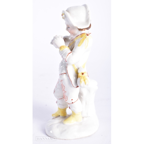 329 - AN ANTIQUE CONTINENTAL PORCELAIN FIGURE OF A BOY. 13 cm high.