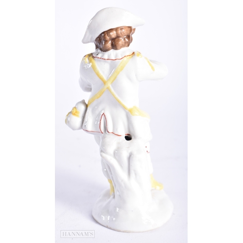 329 - AN ANTIQUE CONTINENTAL PORCELAIN FIGURE OF A BOY. 13 cm high.