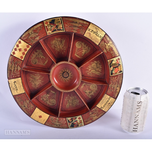 332 - A CHARMING 19TH CENTURY CHINOISERIE LACQUERED WOOD GAMING BOARD. 29cm diameter.