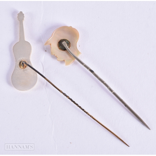 336 - TWO UNUSUAL ANTIQUE MOTHER OF PEARL JOCKEY AND CELLO TIE PINS. 3.5 grams. 8.5 cm x 3.25cm. (2)