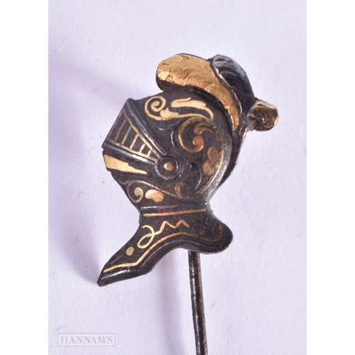 338 - AN UNUSUAL ANTIQUE DAMASCENED KNIGHT HEAD TIE Ping. 2.6 grams. 7 cm x 1 cm.