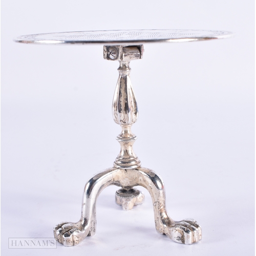 340 - AN UNUSUAL ANTIQUE SILVER PLATED TILT TOP TABLE. 15 cm x 9 cm tilted.