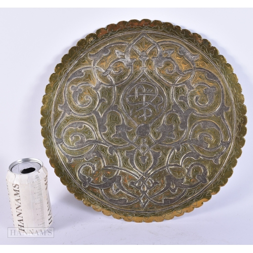 367 - A LARGE 19TH CENTURY ISLAMIC SILVER OVERLAID EASTERN DISH decorated with flowers and scripture. 32 c... 