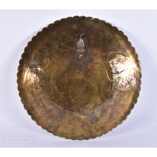 367 - A LARGE 19TH CENTURY ISLAMIC SILVER OVERLAID EASTERN DISH decorated with flowers and scripture. 32 c... 