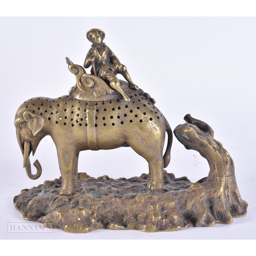 373 - AN UNUSUAL EARLY 19TH CENTURY REGENCY BRONZE FIGURAL GROUP depicting a male upon a pierced elephant.... 