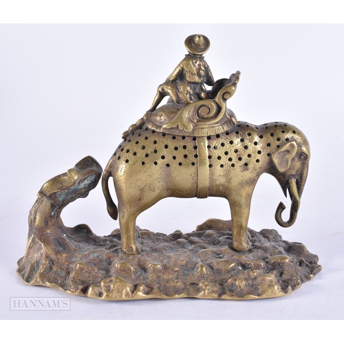 373 - AN UNUSUAL EARLY 19TH CENTURY REGENCY BRONZE FIGURAL GROUP depicting a male upon a pierced elephant.... 