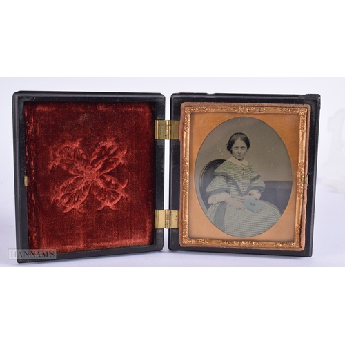 401 - A 19TH CENTURY DAGUERREOTYPE PHOTOGRAPH the case decorated with a central motif flanked by floral sc... 